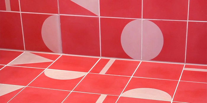 Modern cement tiles in strong pink tones